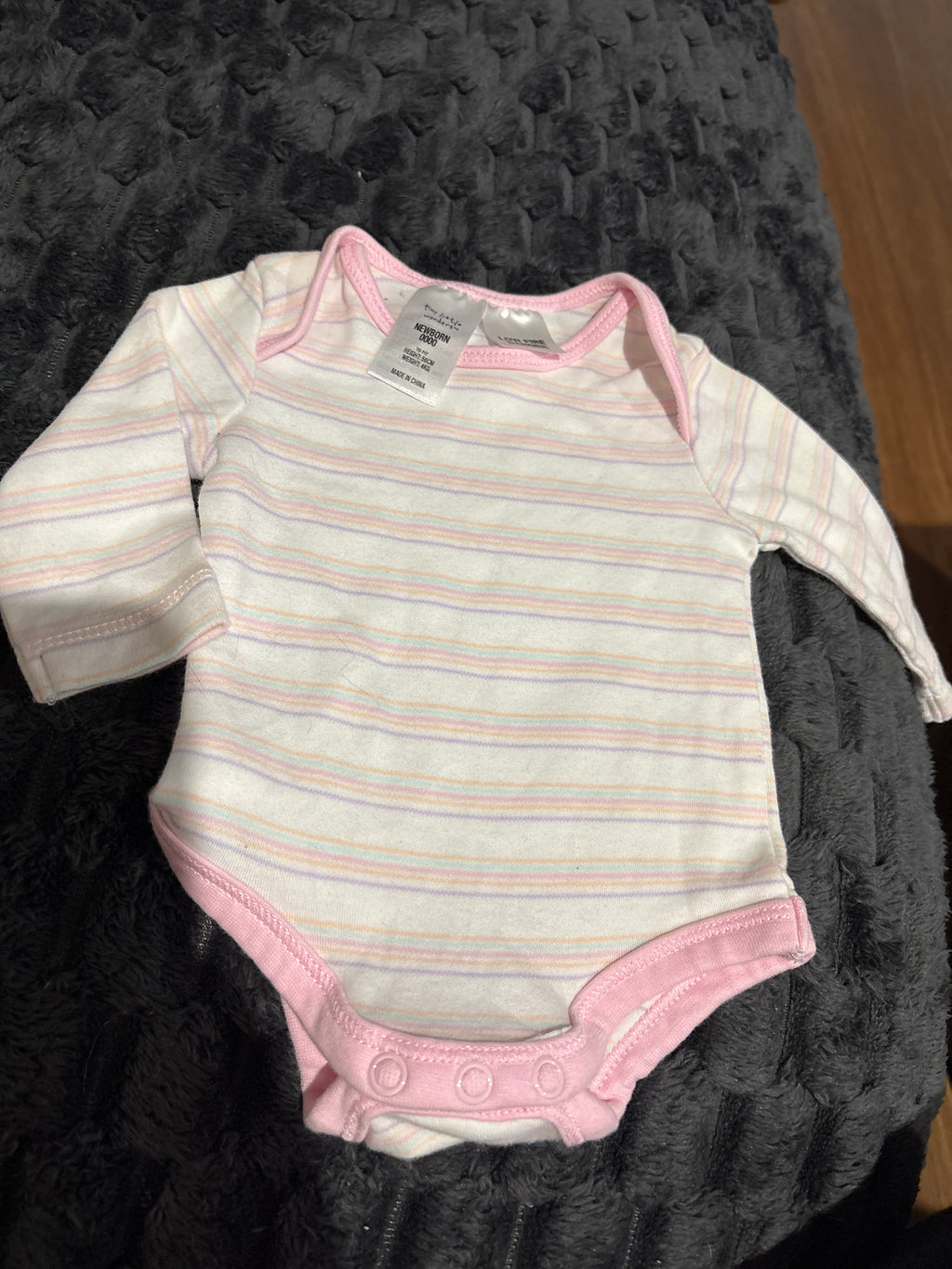 Tiny Treasures long sleeve body suit. Size 0000