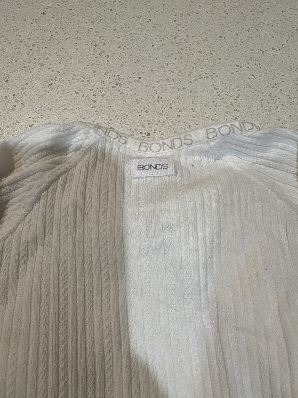 4 size 000 coveralls including Bonds, Anko & Dymples