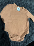 Target organic cotton long sleeve bodysuit. Size 0000
