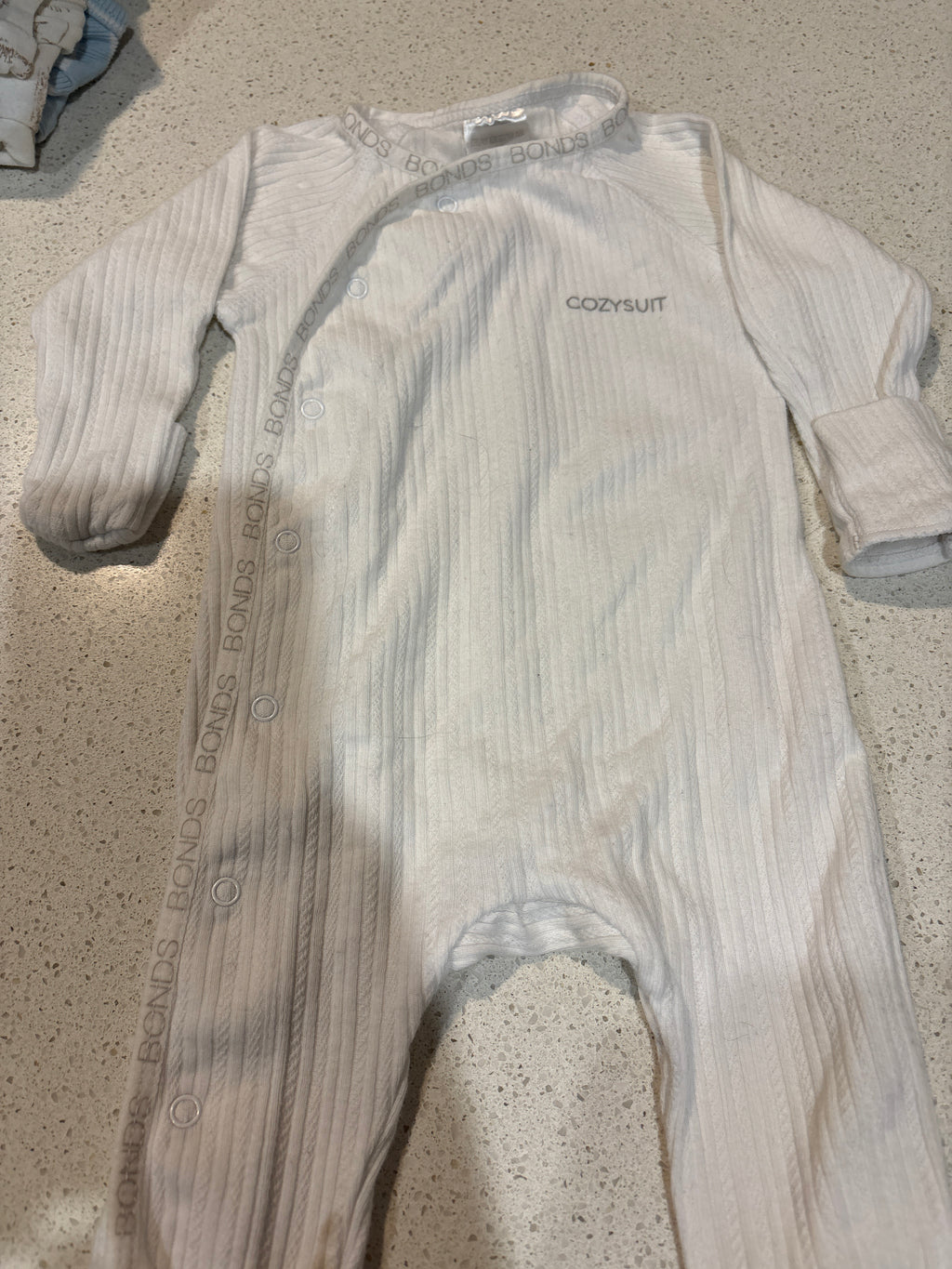 4 size 000 coveralls including Bonds, Anko & Dymples