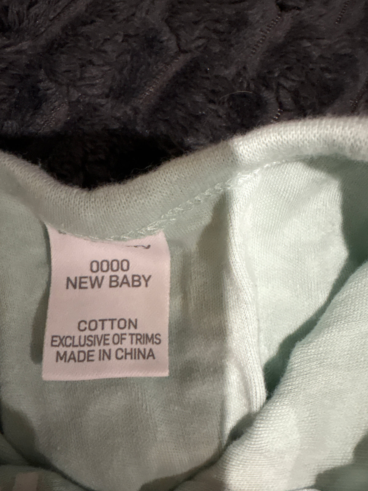 Baby Berry unisex pale green and white patterned coverall. Size 0000