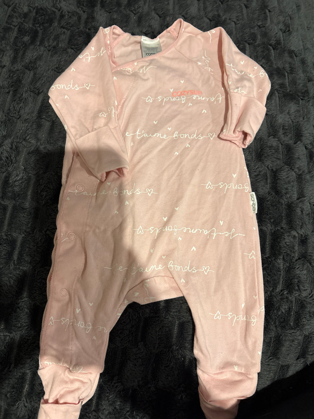Bonds light pink Cozysuit. Size 0000