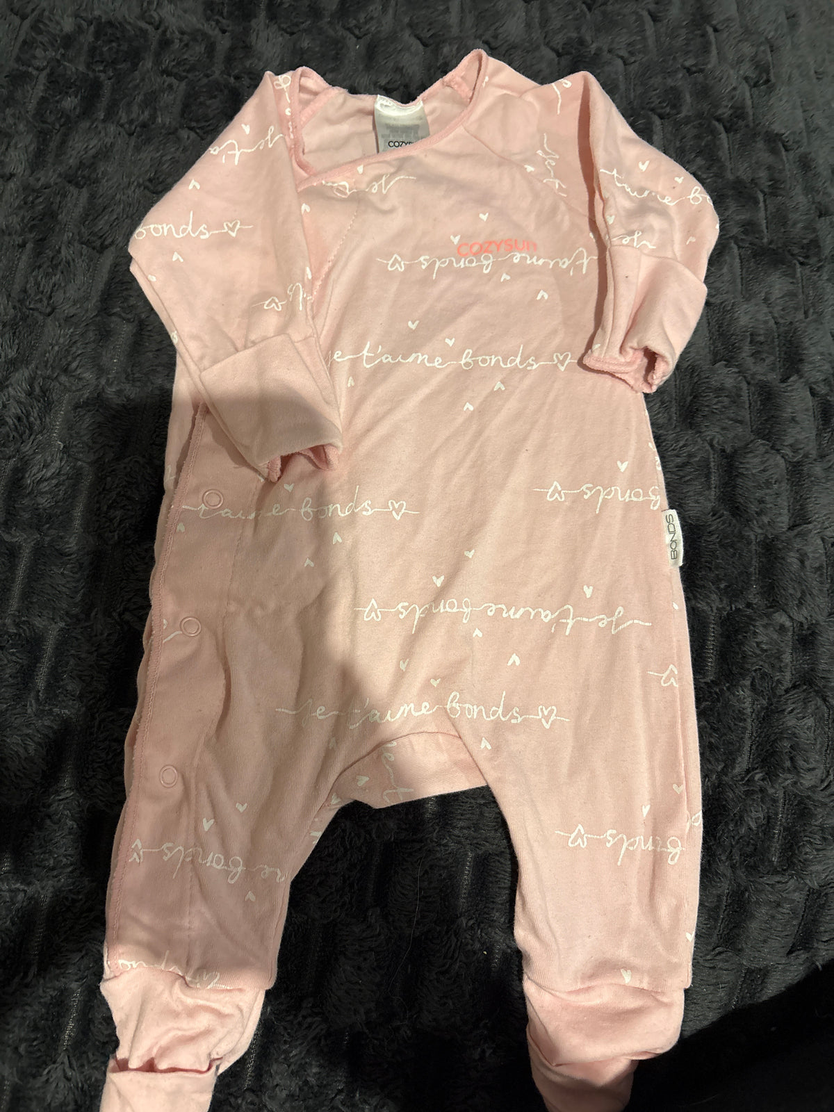 Bonds light pink Cozysuit. Size 0000