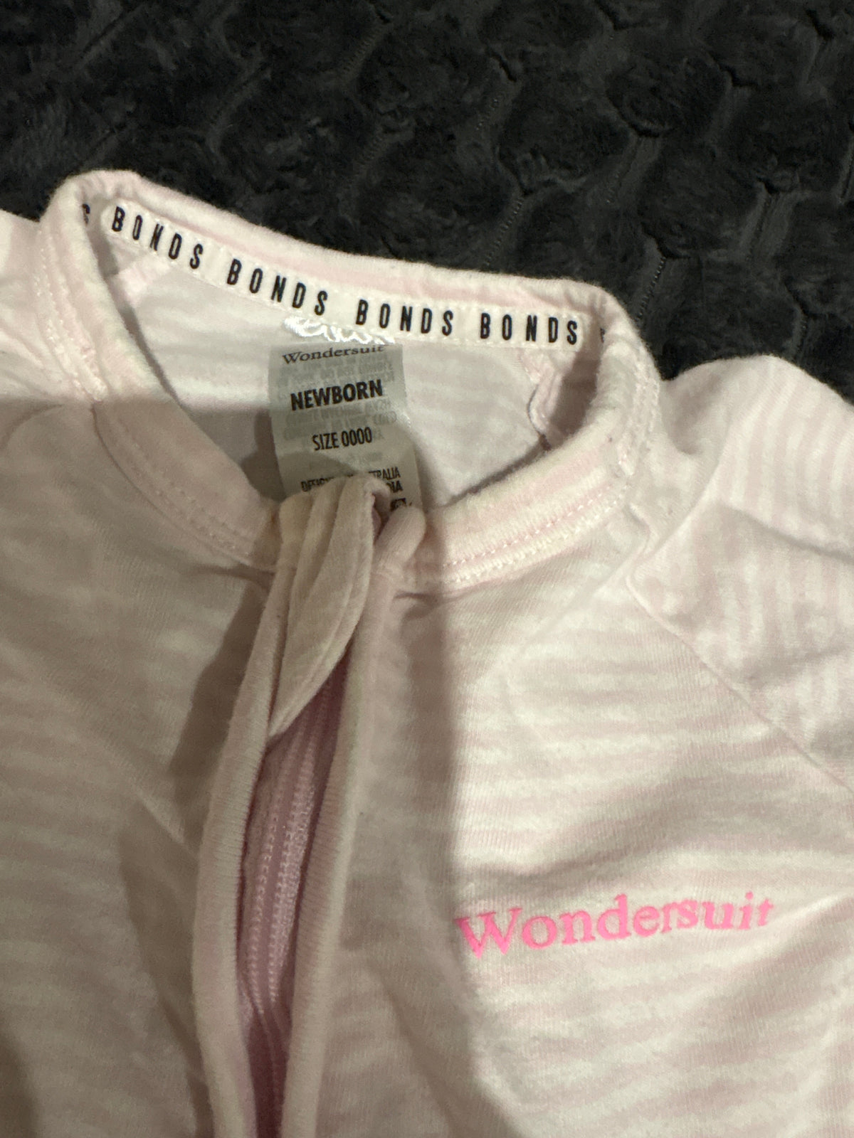 Bonds pink and white stripped Wondersuit. Size 0000