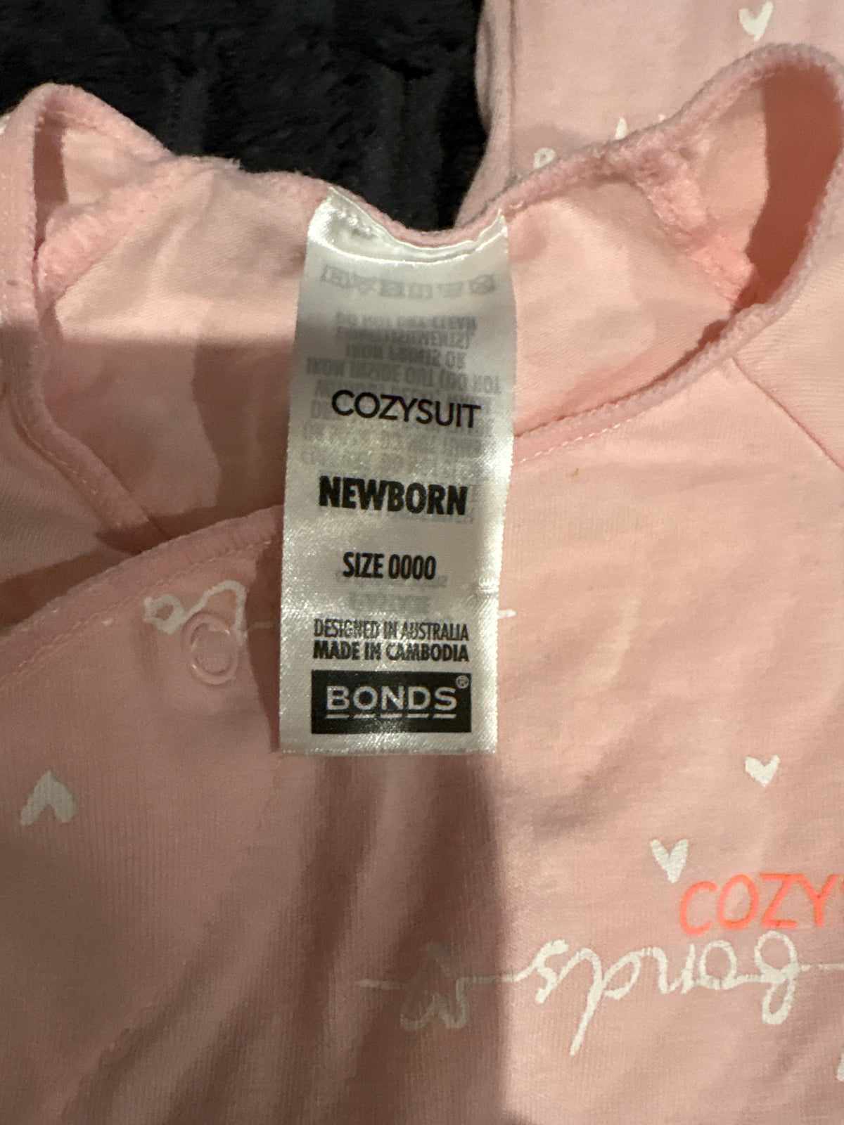 Bonds light pink Cozysuit. Size 0000